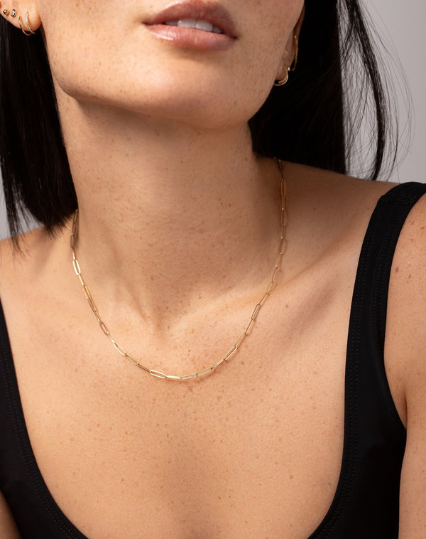 14k yellow gold small link necklace shown on model