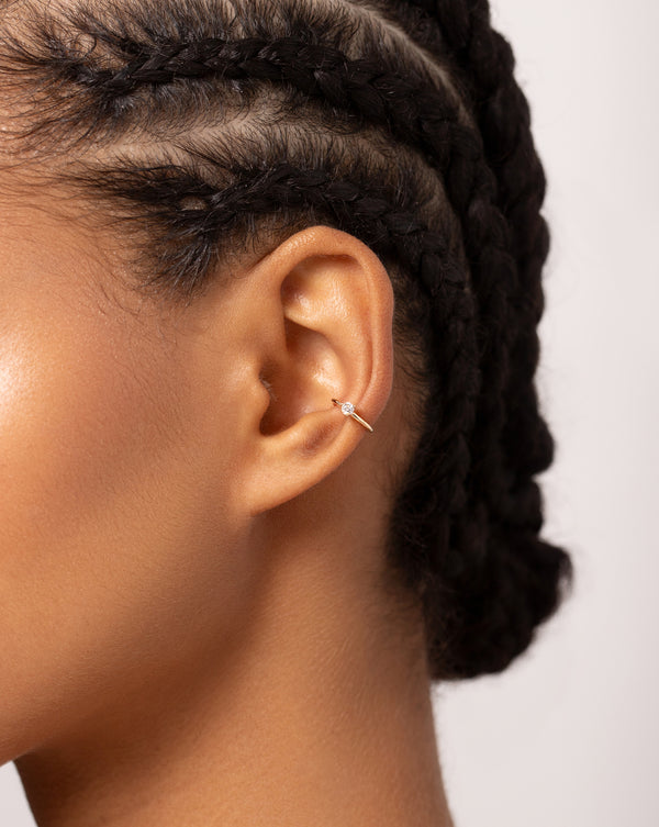 Single Diamond Ear Cuff shown close up on ear of model