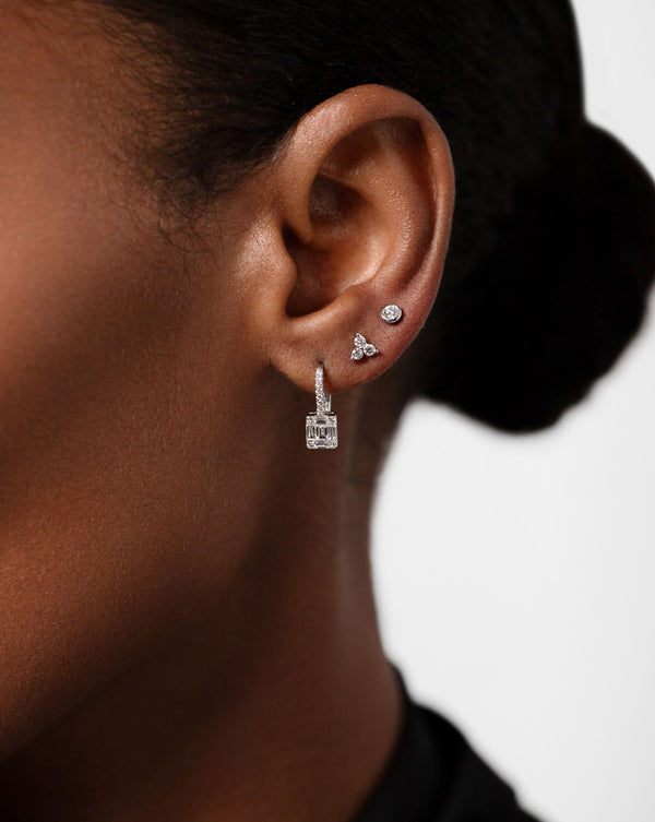 Ring Concierge Earrings 14k White Gold Emerald Illusion Lever Back Earrings - on-model worn on right ear, styled with the Diamond trio Stud and the bezel set petite diamond studs
