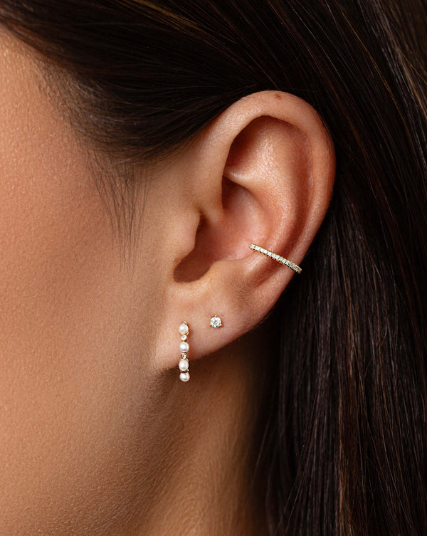 Diamond Ear Cuff styled with Pearl Huggies and tiny diamond studs on model
