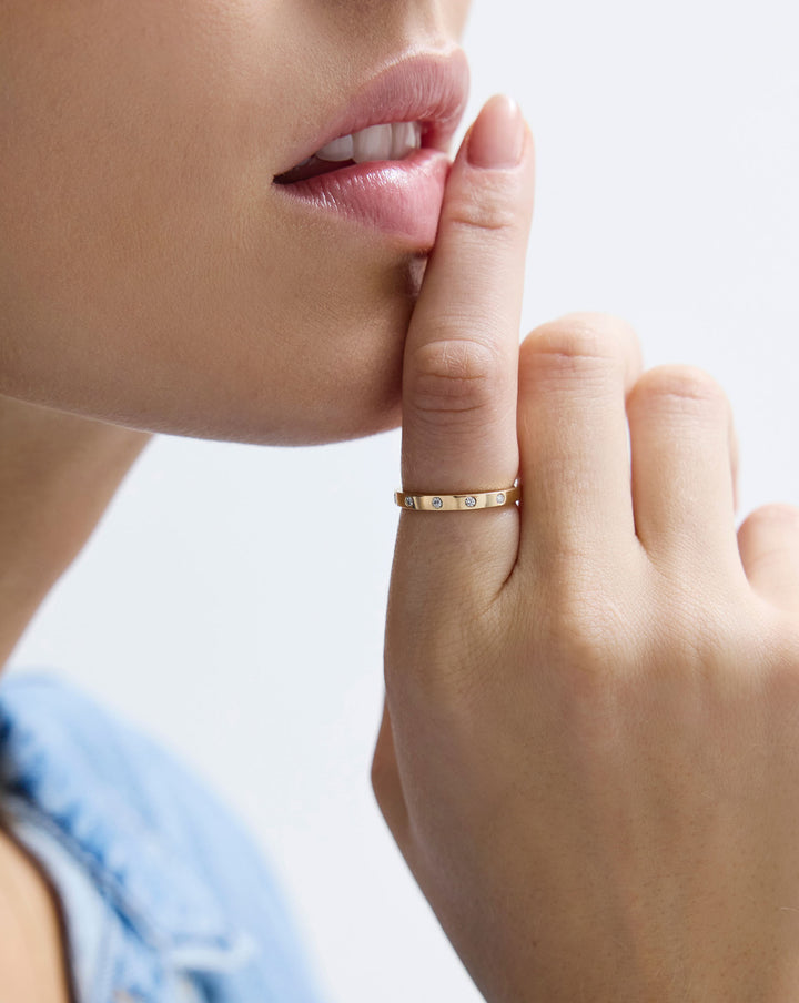 Inlay diamond ring worn on finger, showcasing 1.6mm band width and natural diamond placement