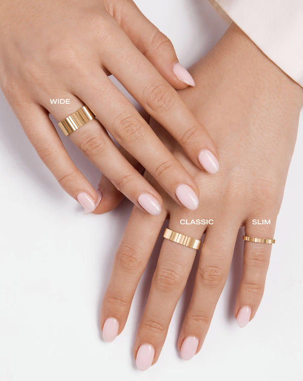 Fluted Gold Stackable Ring- labeled sizes wide, classic and slim on model