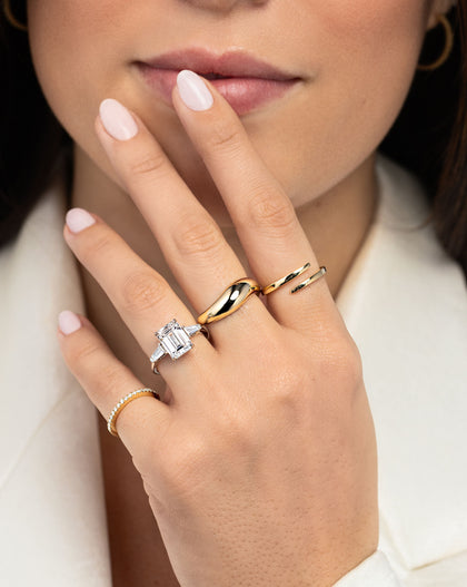 Movement Cloud Ring in middle finger styled with 3 other rings on model