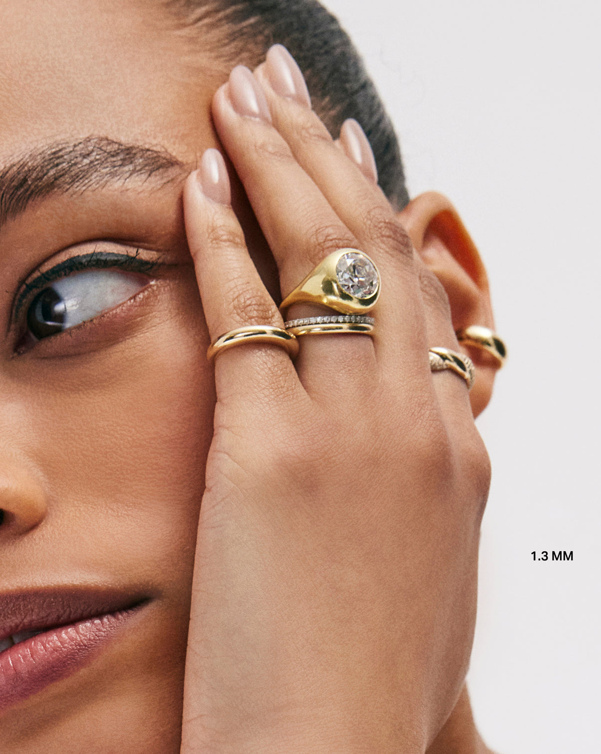 Model wearing 1.3 mm Perfect Pave Diamond Ring in Yellow Gold with other rings GLOBAL