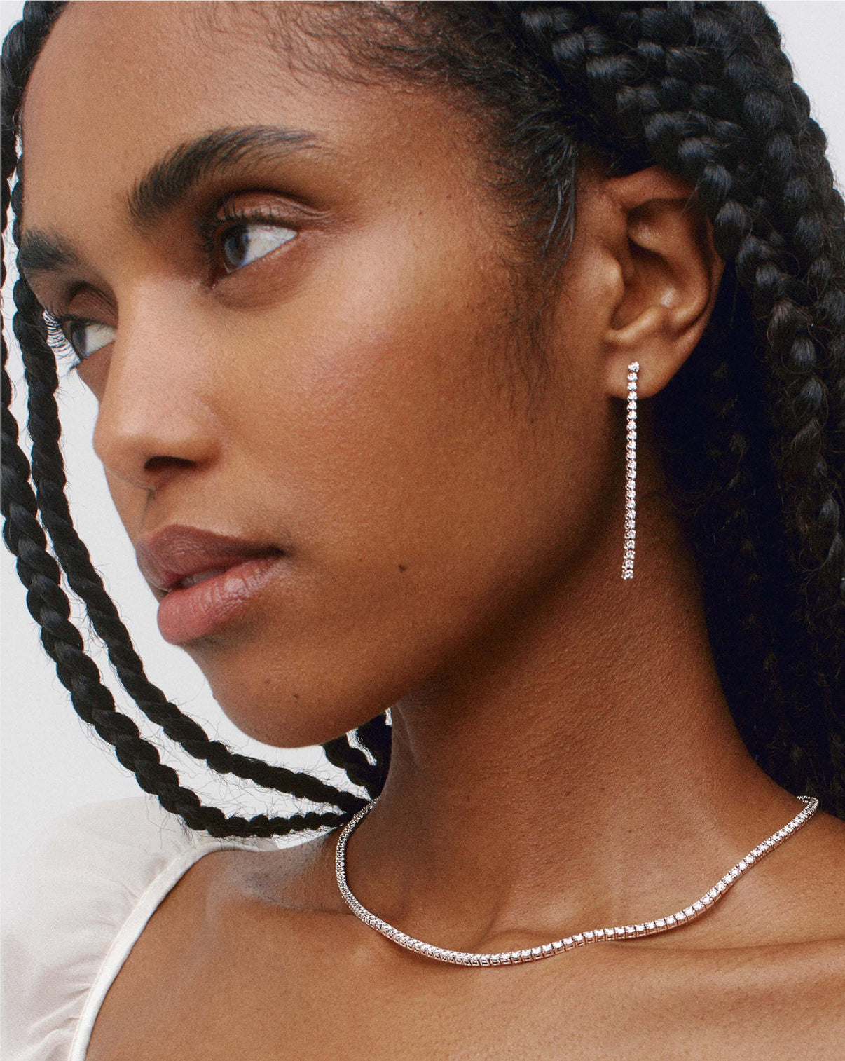 Tennis Trio Earrings styled solo on model