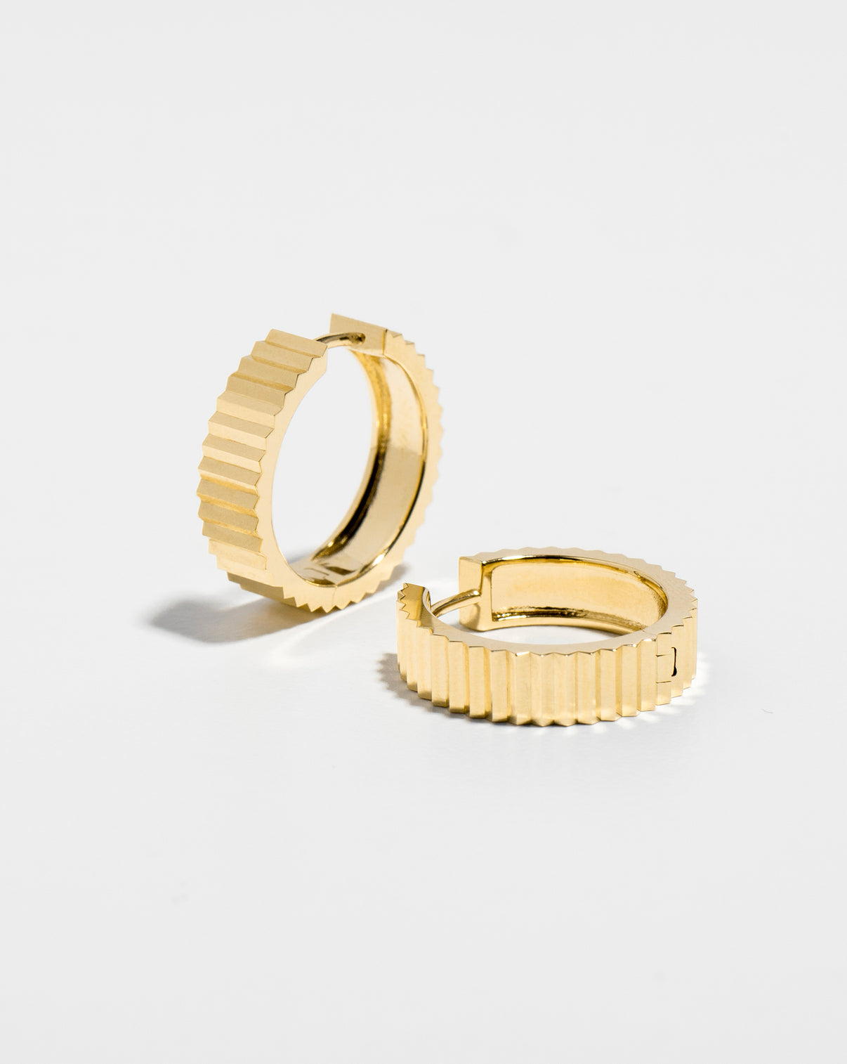 Wide Fluted Gold Hoops flat lay. 14k yellow gold