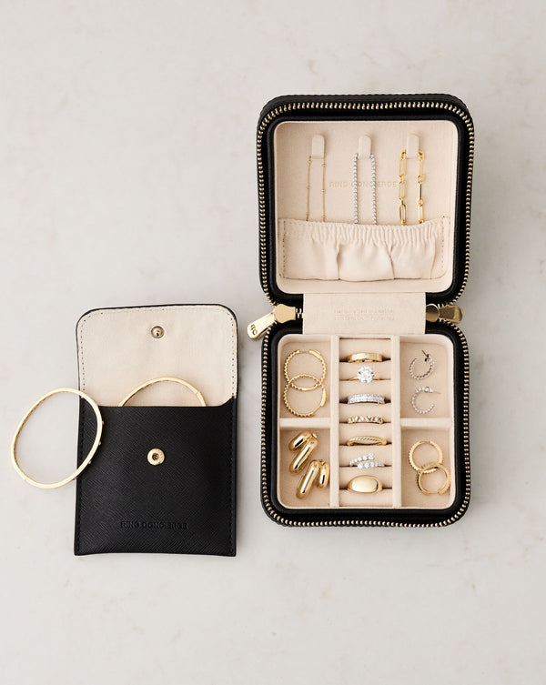Mini Leather Jewelry Case shown open storing jewelry next to open removable leather pouch showing its storage features with bangles peeking out.