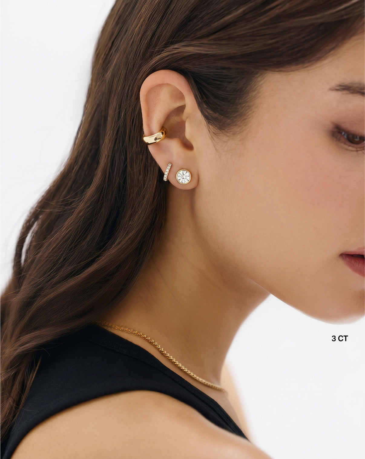 Bezel Round Lab Diamond Studs shown on model with other earrings 44003688775768
