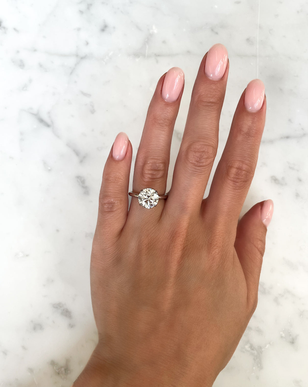 Round Lab Diamond in Cloud Solitaire Hidden Halo top view worn on hand
