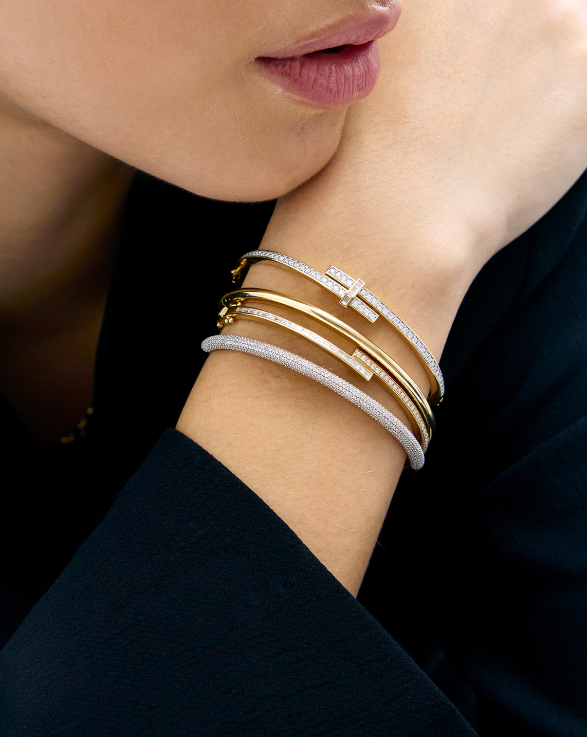 Baguette + Round Diamond Wrap Bangle on model's wrist shown with other Ring Concierge bracelets for comparison.