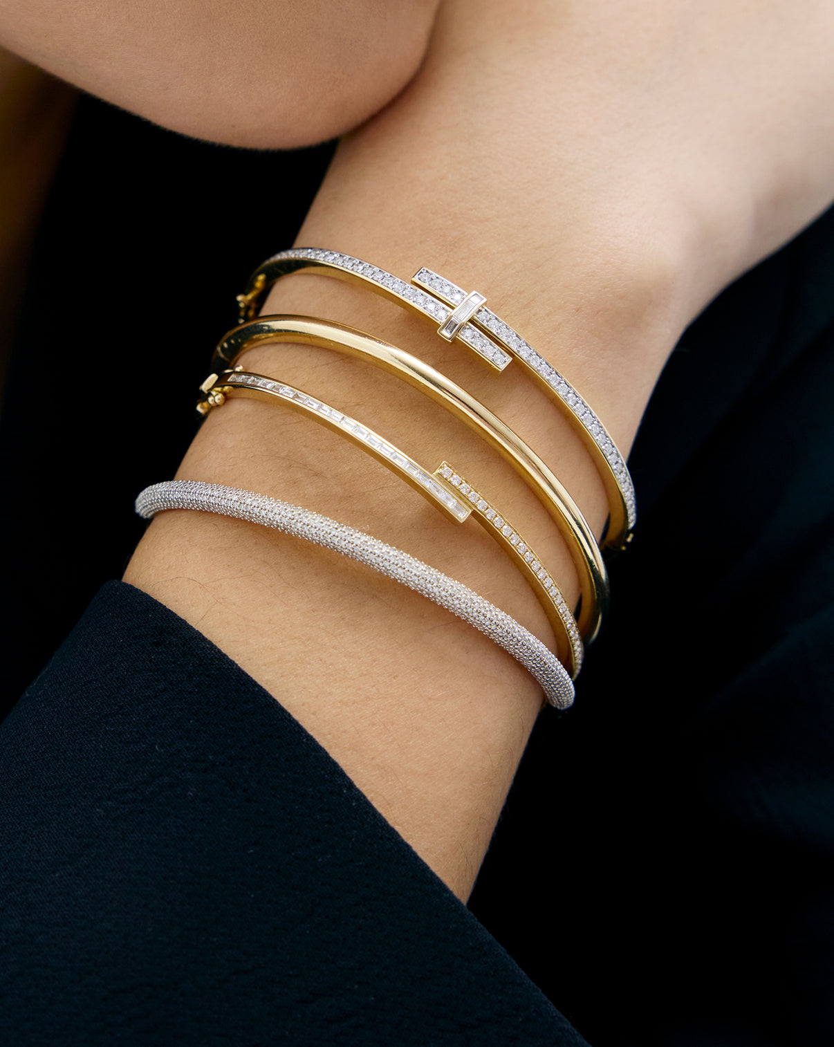 Baguette + Round Diamond Wrap Bangle on model's wrist providing scale reference for the diamond bangle's elegant proportions