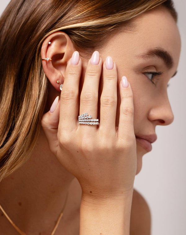 Fanned Diamond Statement Ring shown on hand of model while also wearing the Single Diamond Ear Cuff and Tiny Diamond Stud