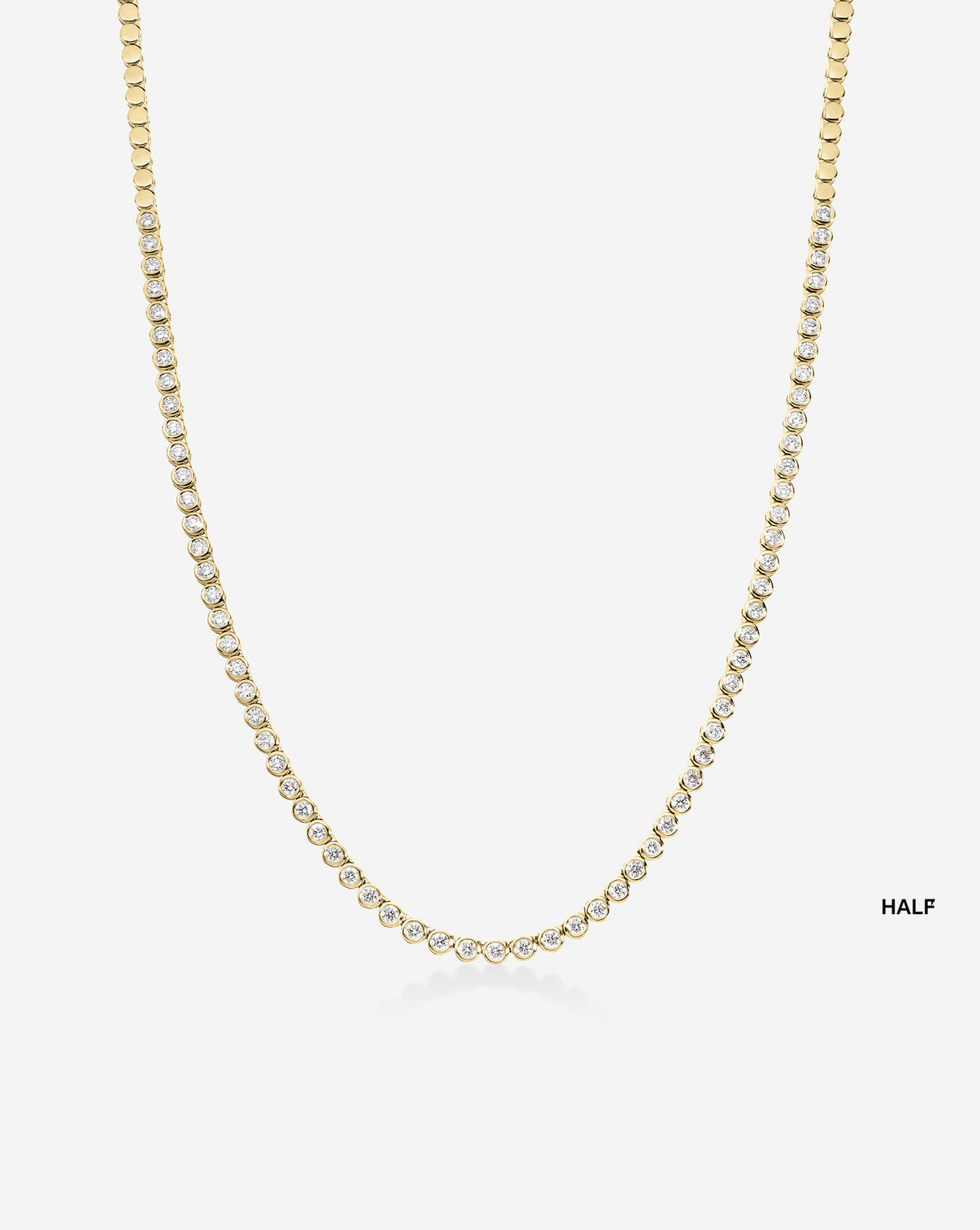 ghost image of bezel tennis necklace half in yellow