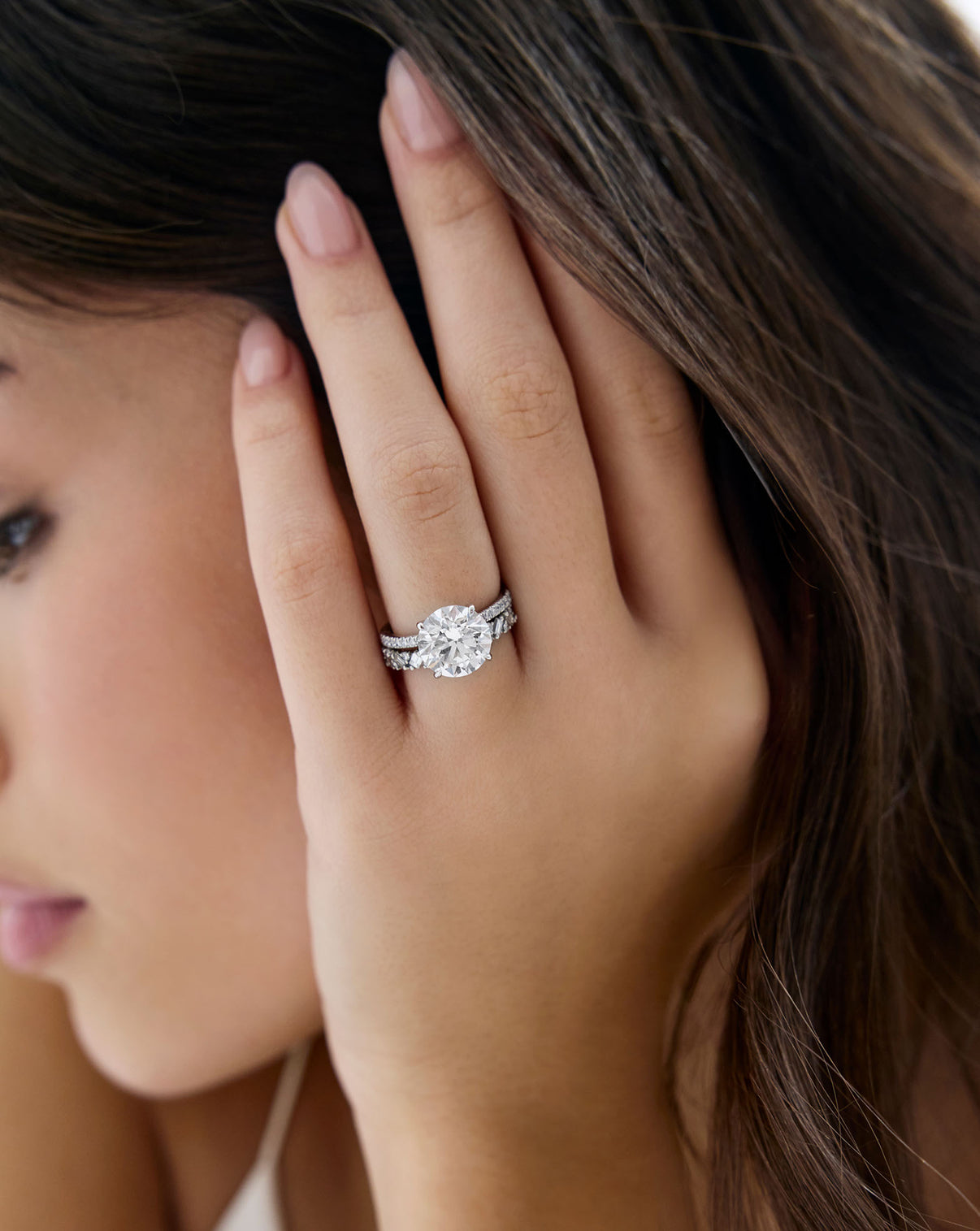 Ring Concierge Baguette Cluster Eternity Band paired with round diamond engagement ring