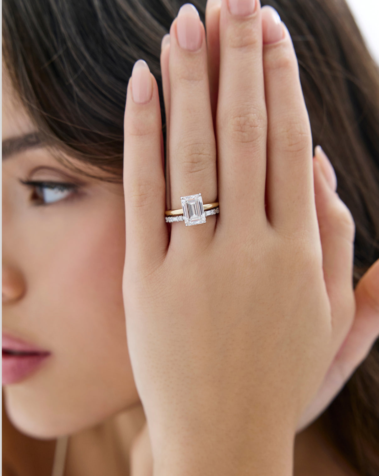 Ring Concierge Baguette + Round Eternity Band Platinum on model paired with emerald engagement ring