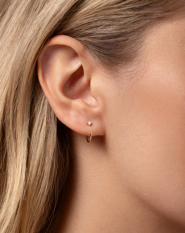 Close up image of the Diamond Droplet Huggies shown on ear of model