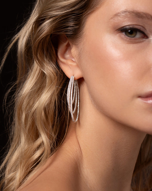 Triple Row Diamond Earrings shown as a side view on ear of model