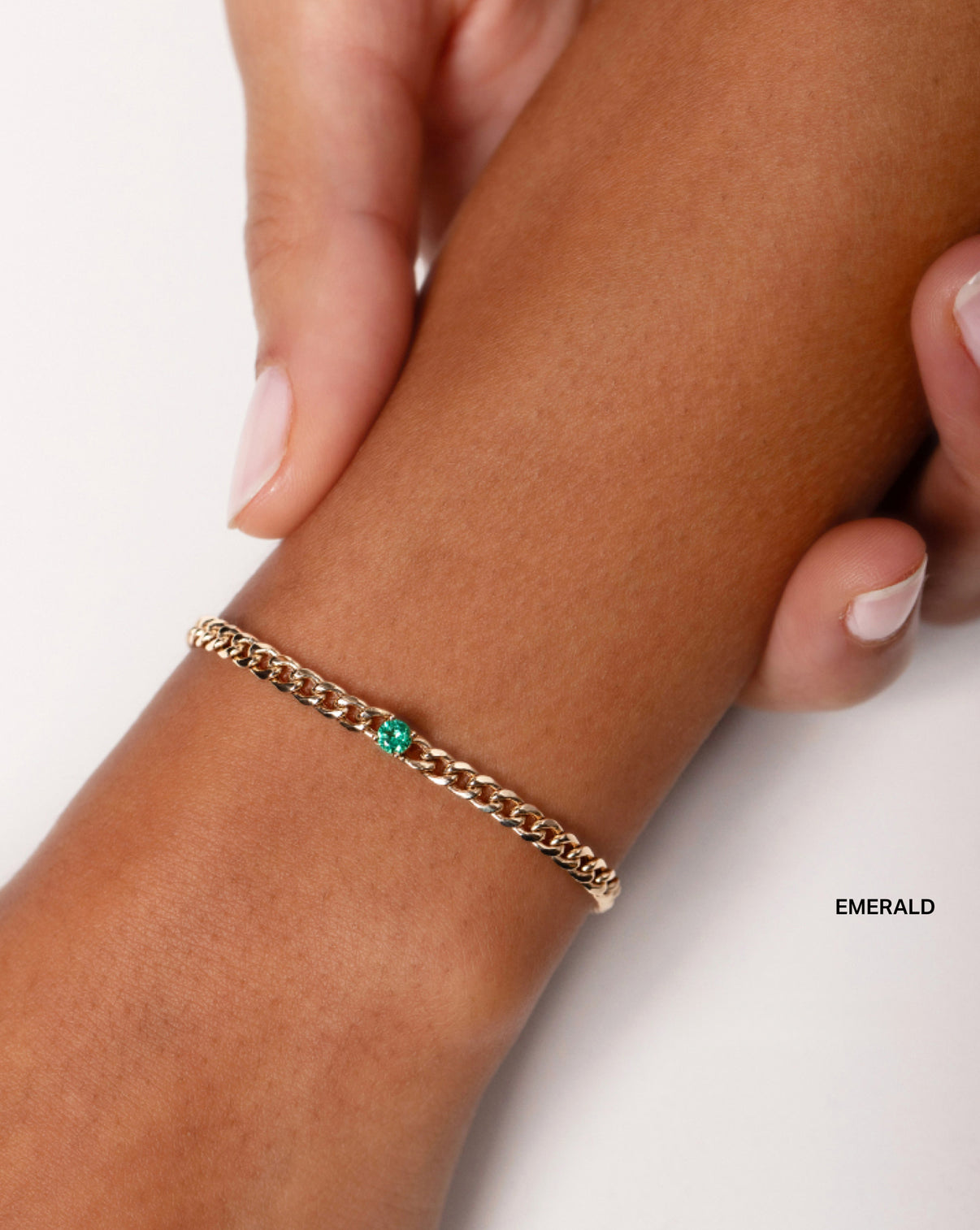 Personalized Curb Chain Birthstone Bracelet with Emerald stone shown on wrist