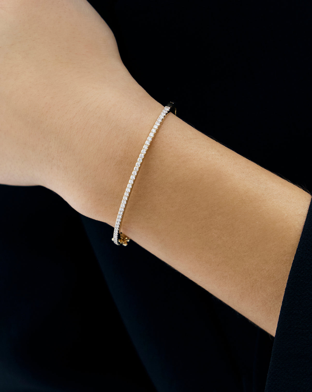 Classic Diamond Bangle in 14K Yellow Gold on model's arm