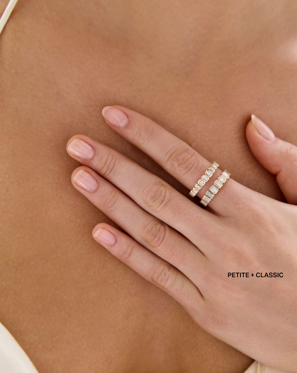 model wearing petite 2 carat weight and classic 3 carat weight Diamond Emerald Bezel Band ring in 14K Yellow Gold global