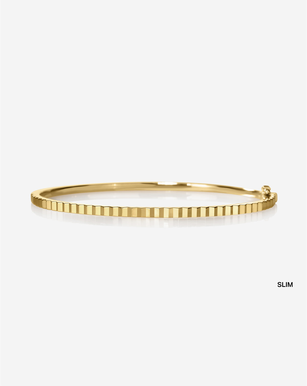 Slim Fluted Gold Bangle product shot highlighting the luxurious ridged surface and gold brilliance