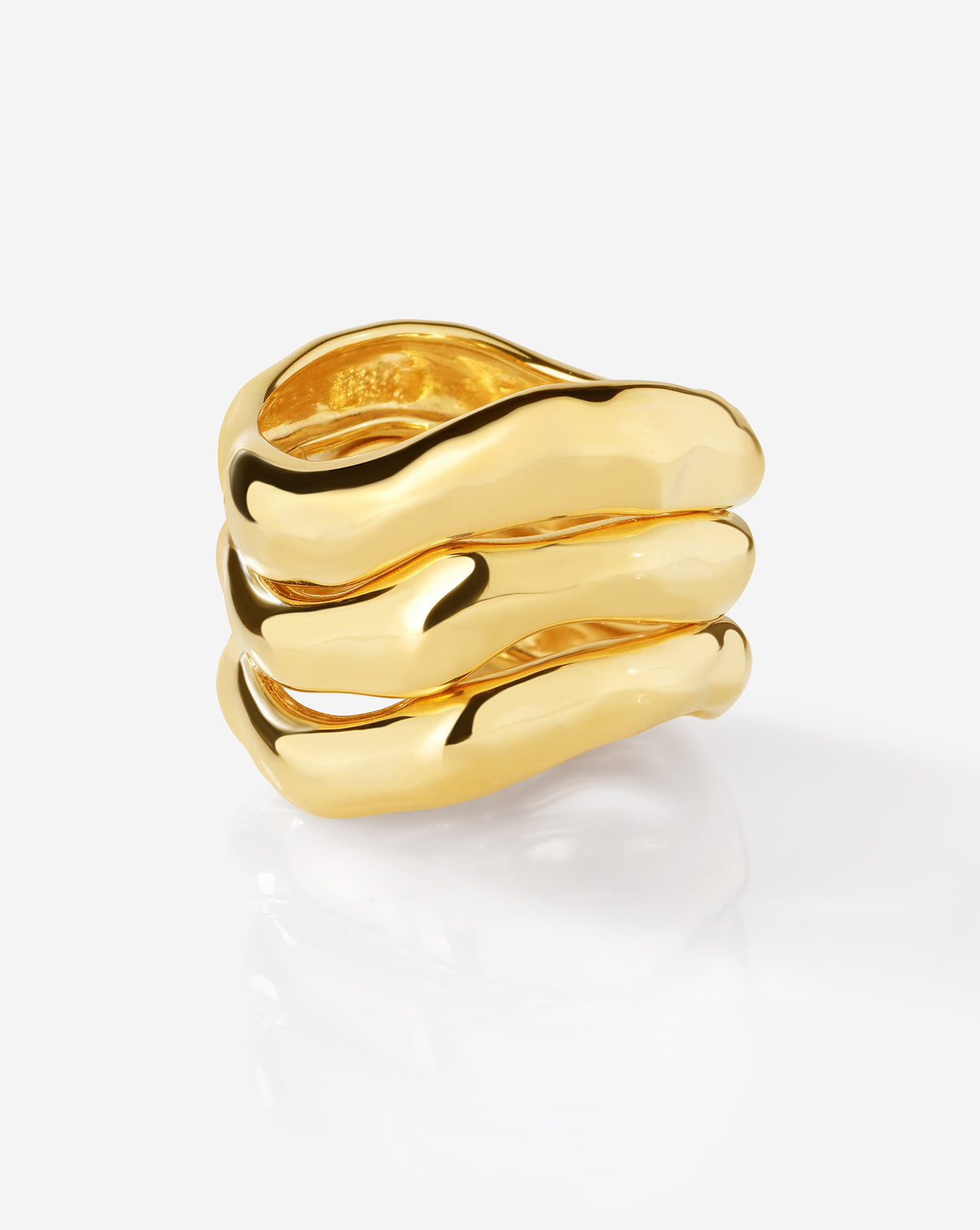 Ring Concierge Melted Stackable Ring Set featuring three gold rings with organic, flowing forms displayed on white background