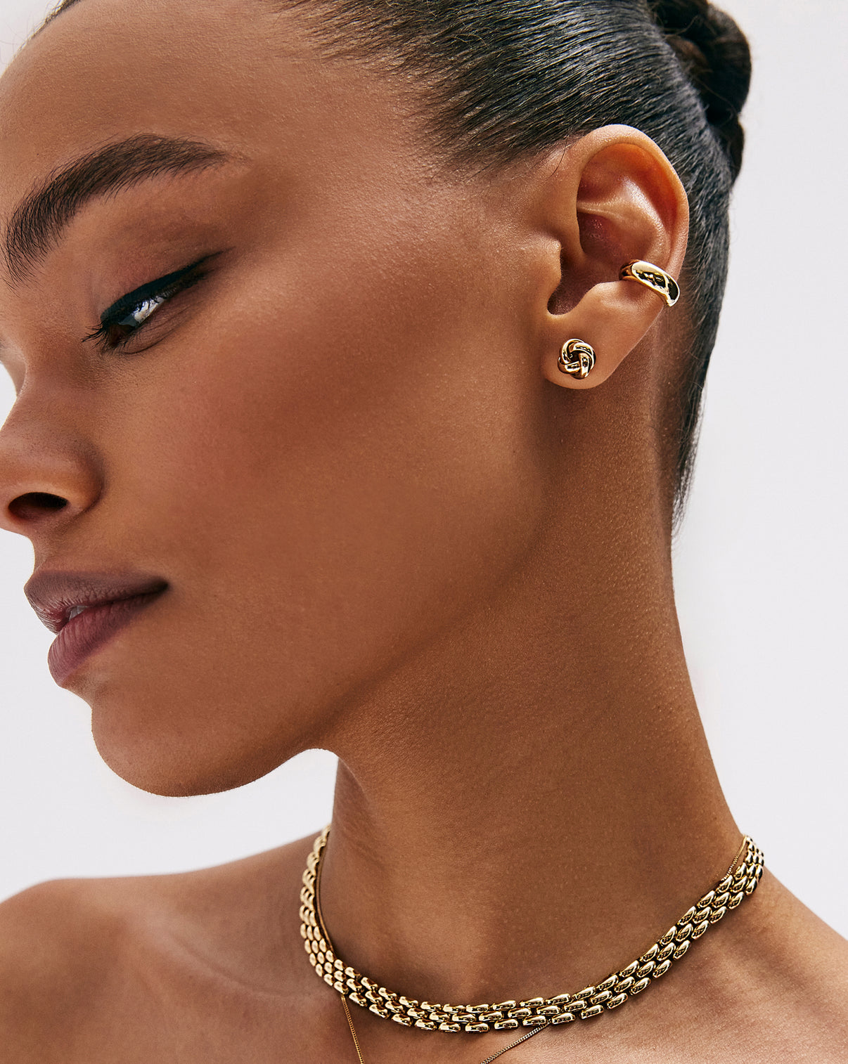 Ring Concierge Gold Cloud Ear Cuff 14k Yellow Gold - on-model on left ear styled with knot studs