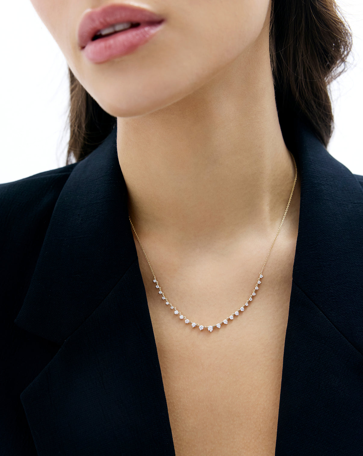Graduated Diamond Layering Necklace shown in 14k yellow gold on neck of model