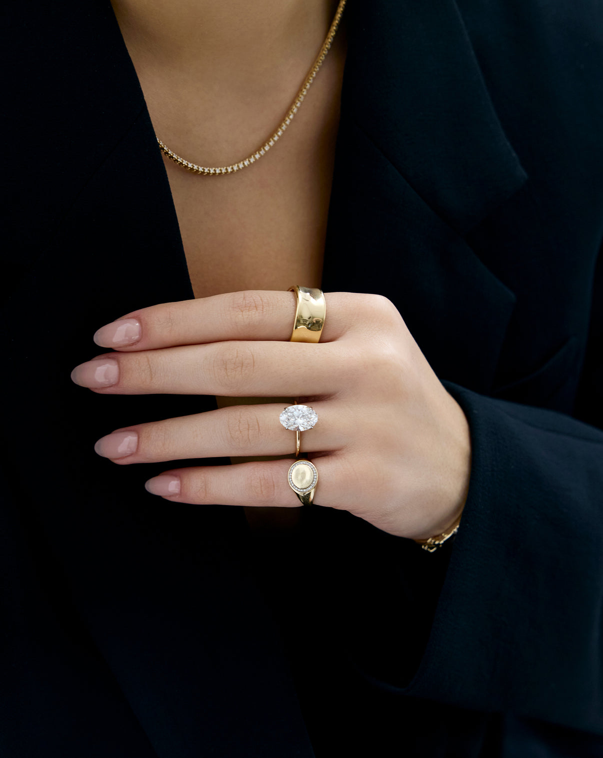 Liquid Gold Ring worn by model styled with some of our other favorite rings