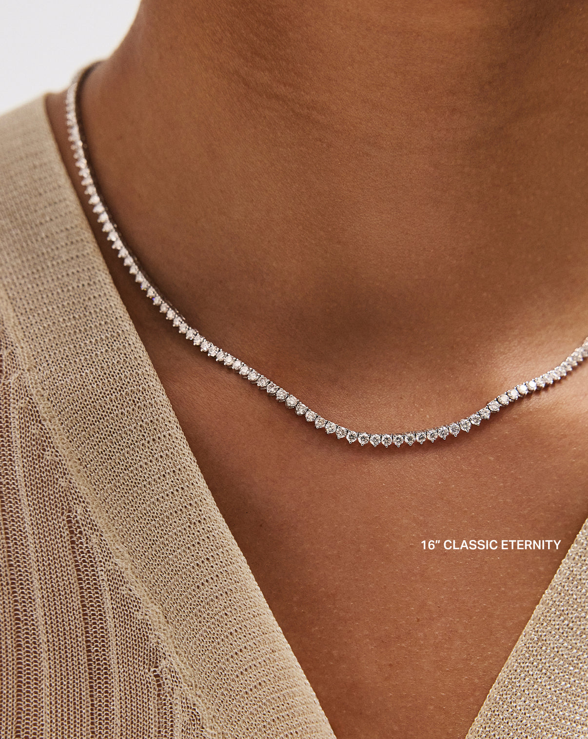 Professional model displaying the 16 inch classic eternity precision-set round diamonds of the Martini Tennis Necklace, featuring expertly crafted three-prong mountings global