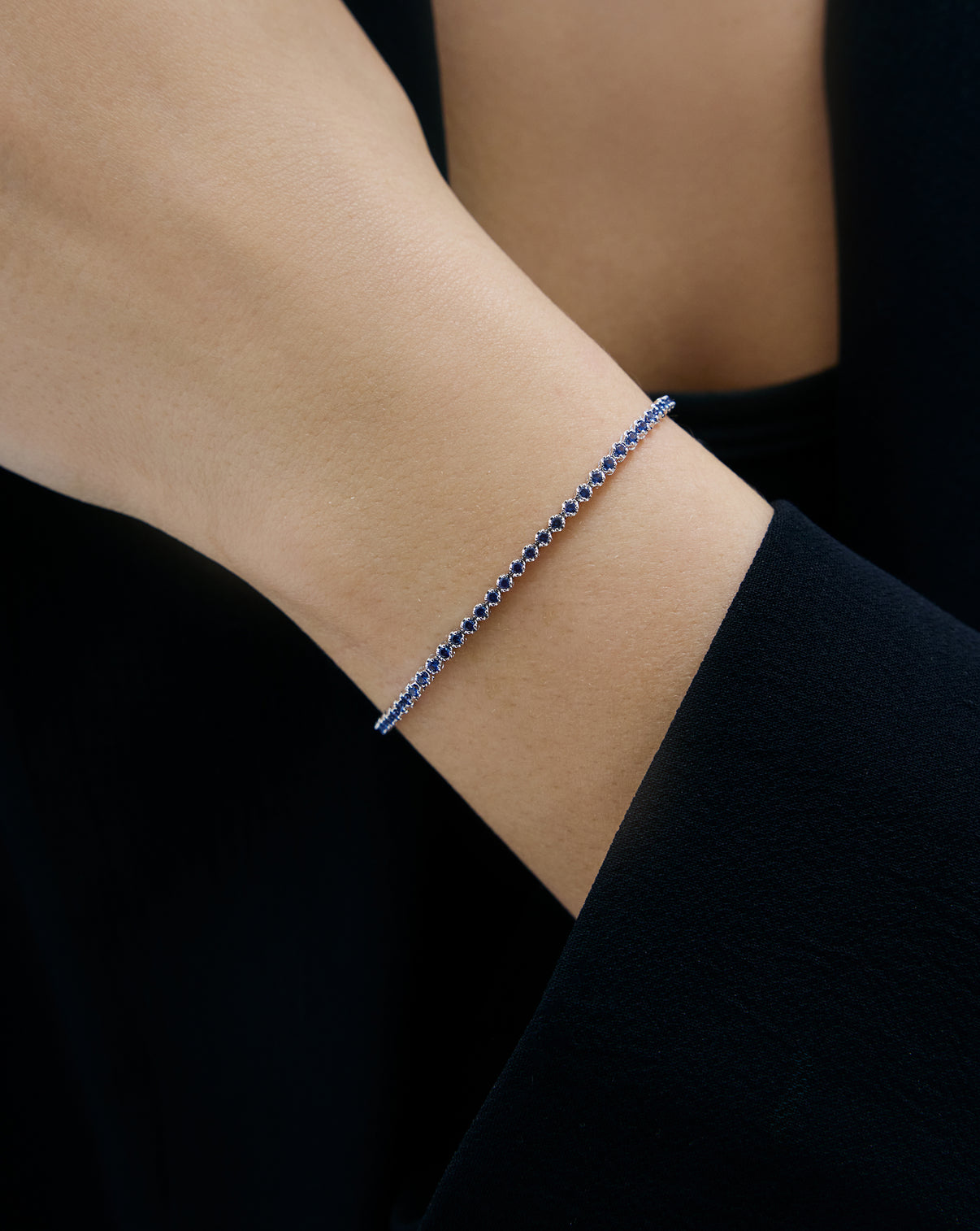 Mini Gemstone Tennis Bracelet Blue Sapphire half on model white gold 43895713333336