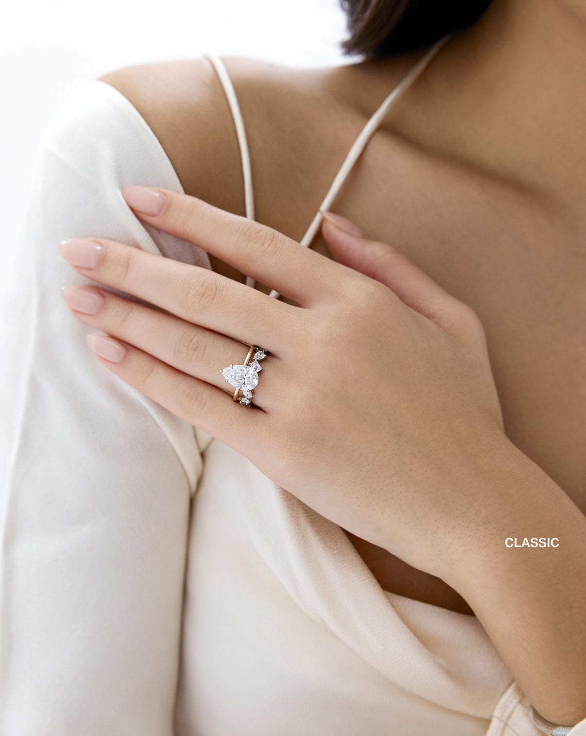 Classic Mixed Shape Eternity Band paired with engagement ring worn by model - global