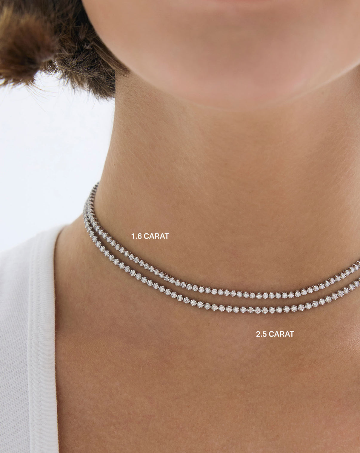1.6 carat and 2.5 carat worn together on model neck - global