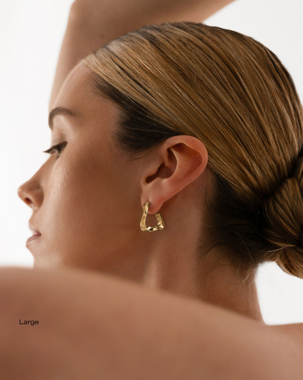 Ring Concierge Movement Geometric Hoops 14k Yellow Gold - on-model on left ear, large size