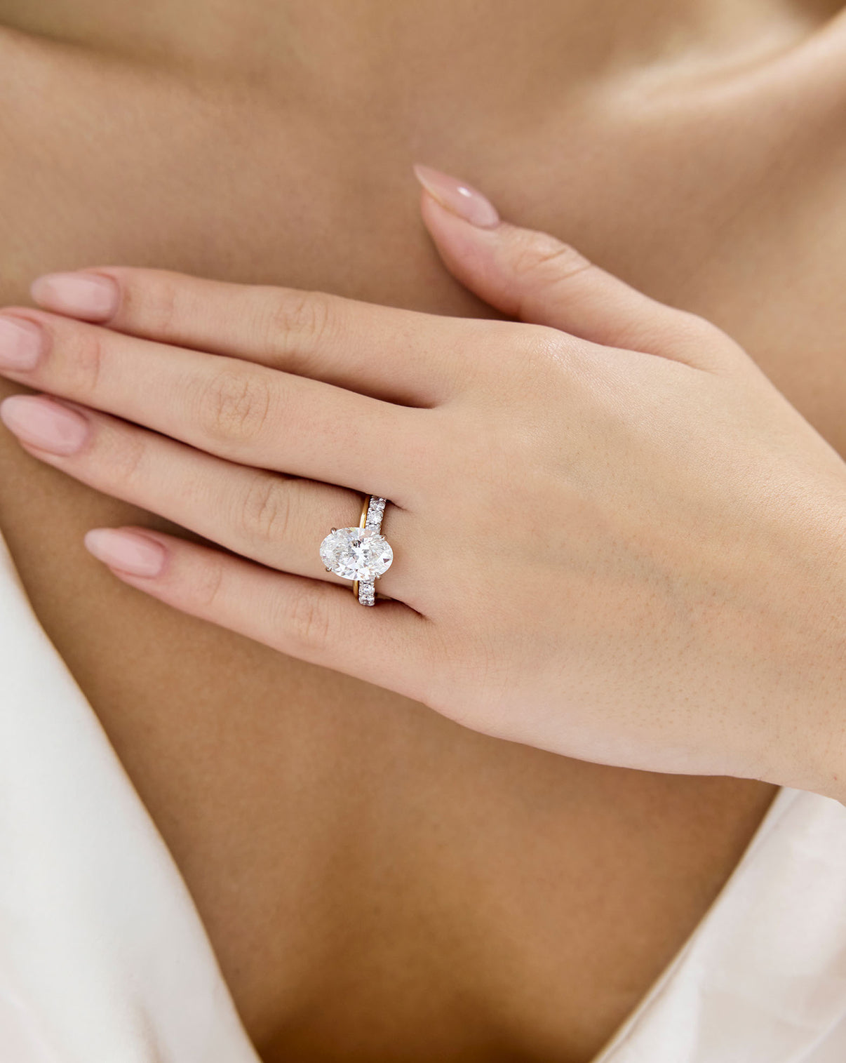 Open Diamond Band in 14K Yellow Gold stacked with oval engagement ring