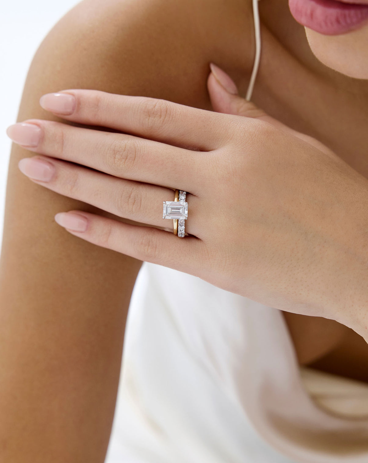 Open Diamond Band in 14K Yellow Gold stacked with emerald engagement ring