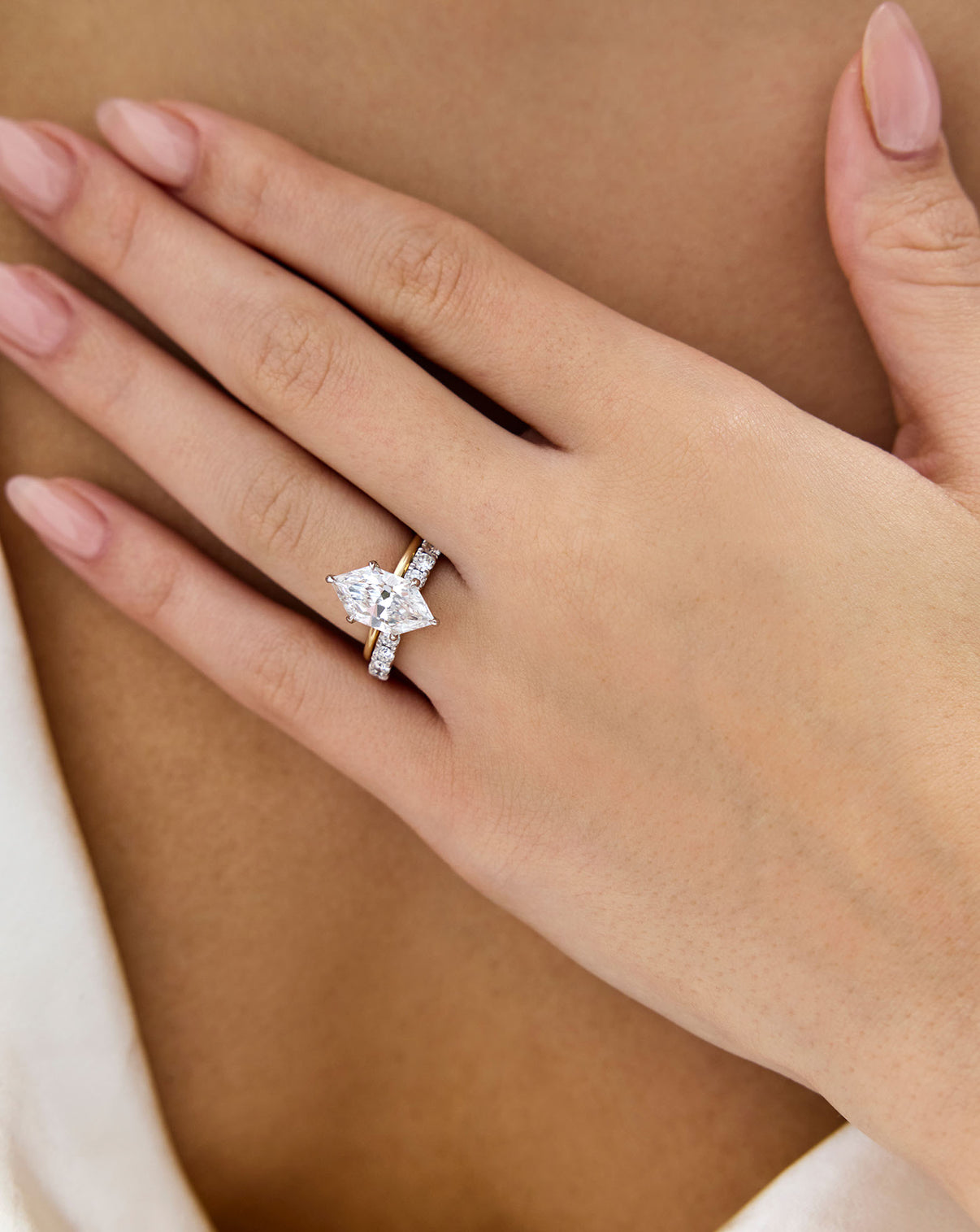 Open Diamond Band in 14K Yellow Gold stacked with ducchess cut engagement ring