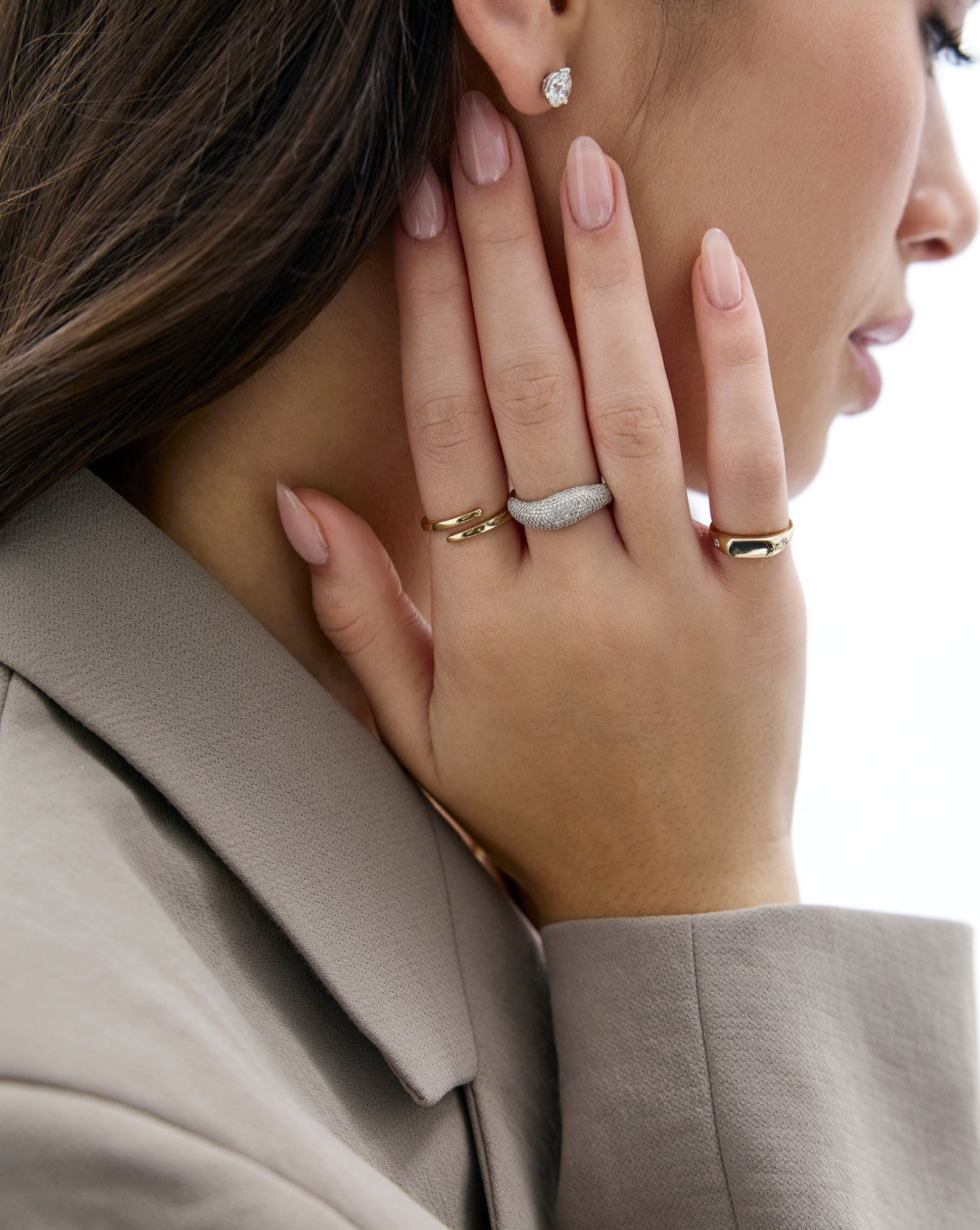 Model wearing 3 Ring Concierge gold and diamond rings GLOBAL