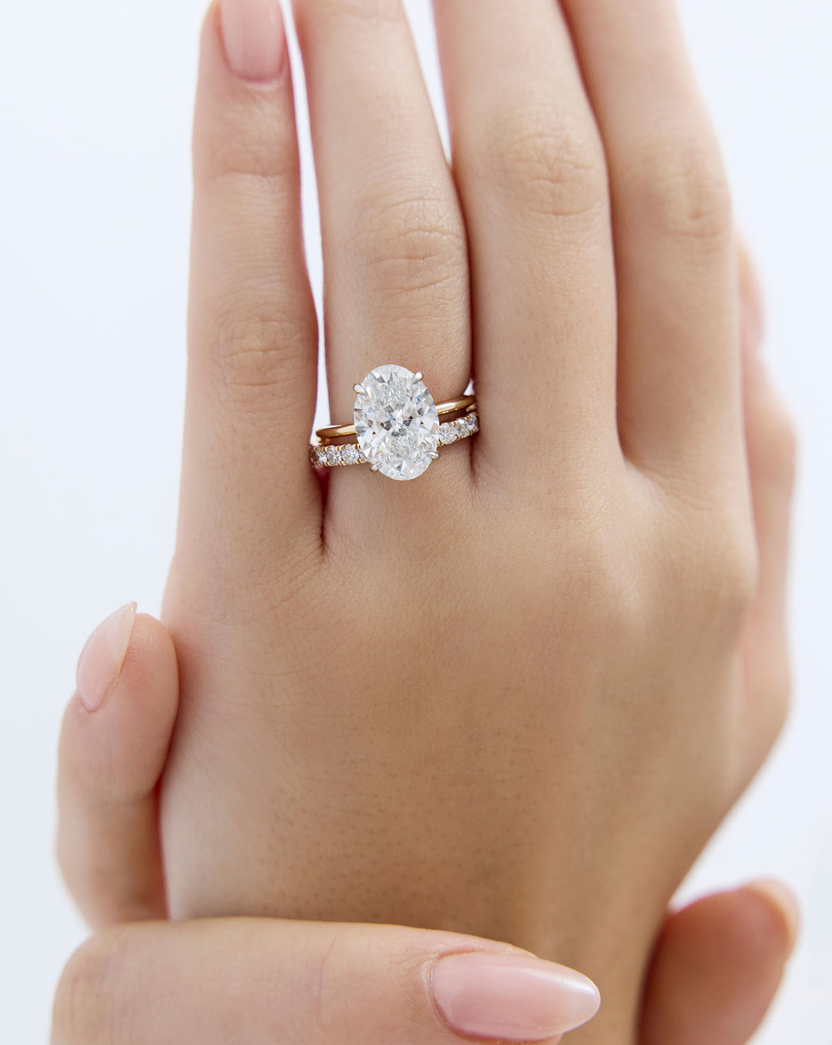 model wearing perfect pave stacked with oval engagement ring global