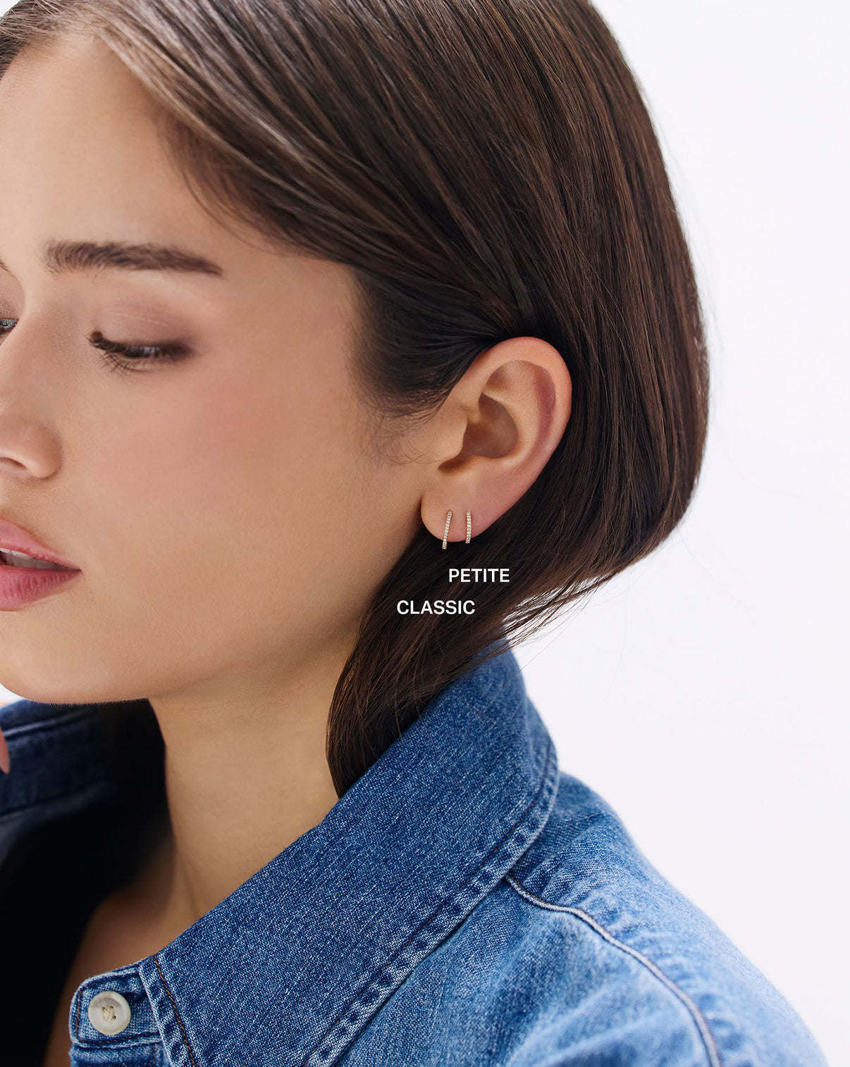 Model wearing Petite Diamond Huggies earrings, front-facing view showing how the diamond huggies complement facial features