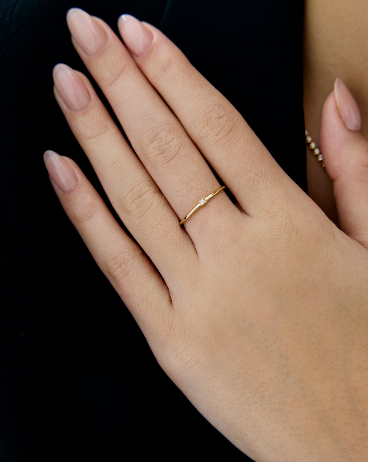 Petite Single Round Diamond Ring in 14k solid gold worn by model