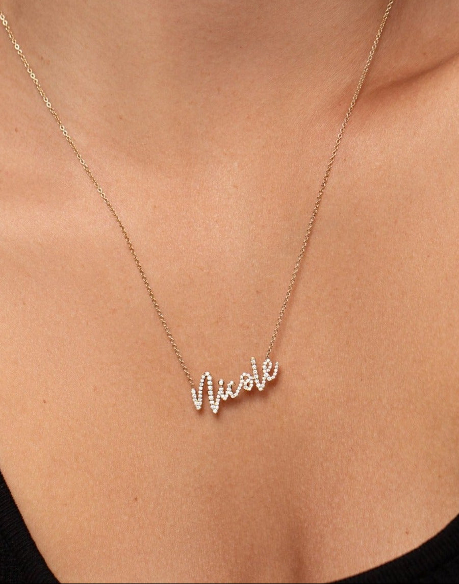 diamond script necklace with the name Nicole shown on model