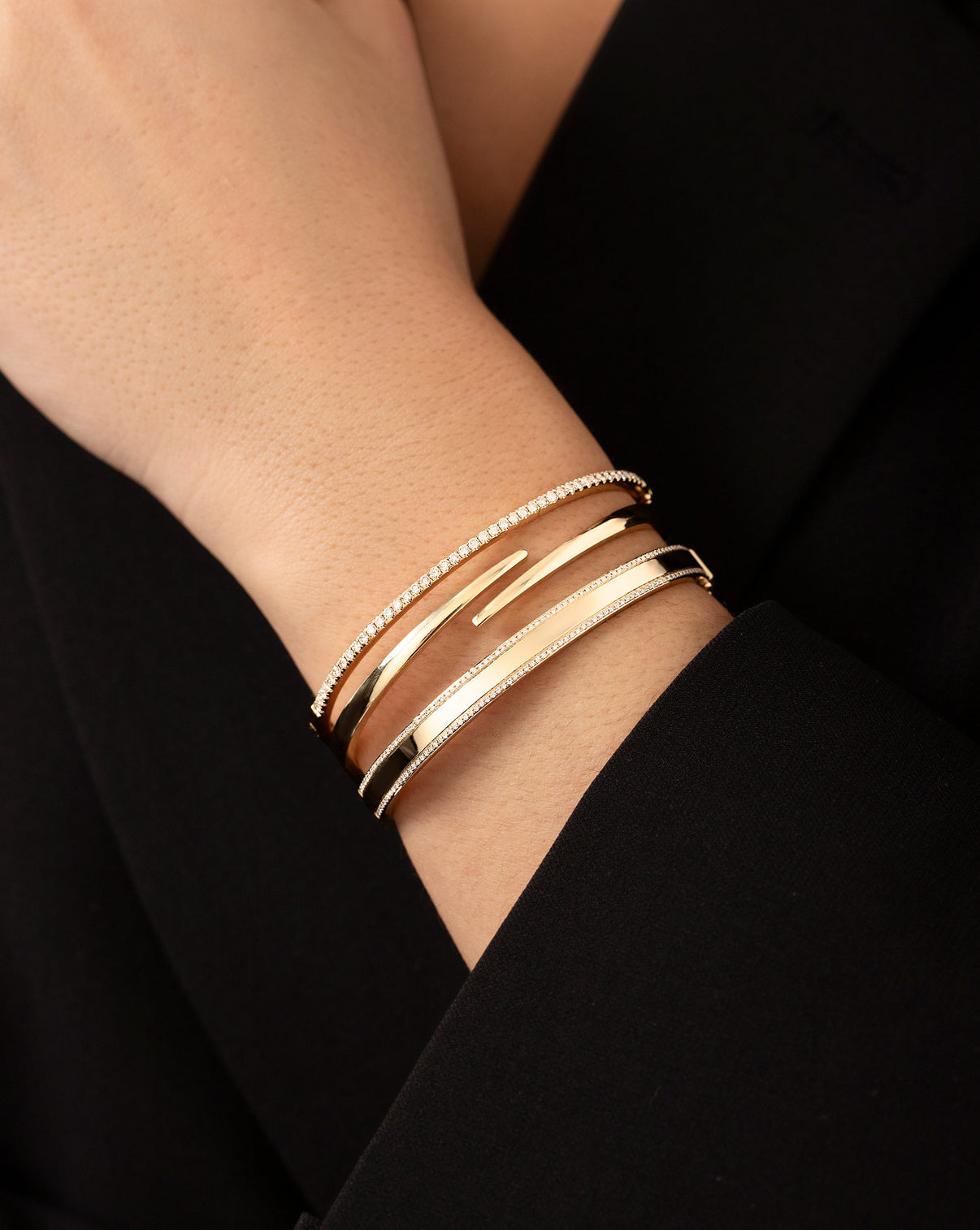 Open Wrap Gold Bangle on model styled with Classic Gold Bangle and Diamond Border Bangle