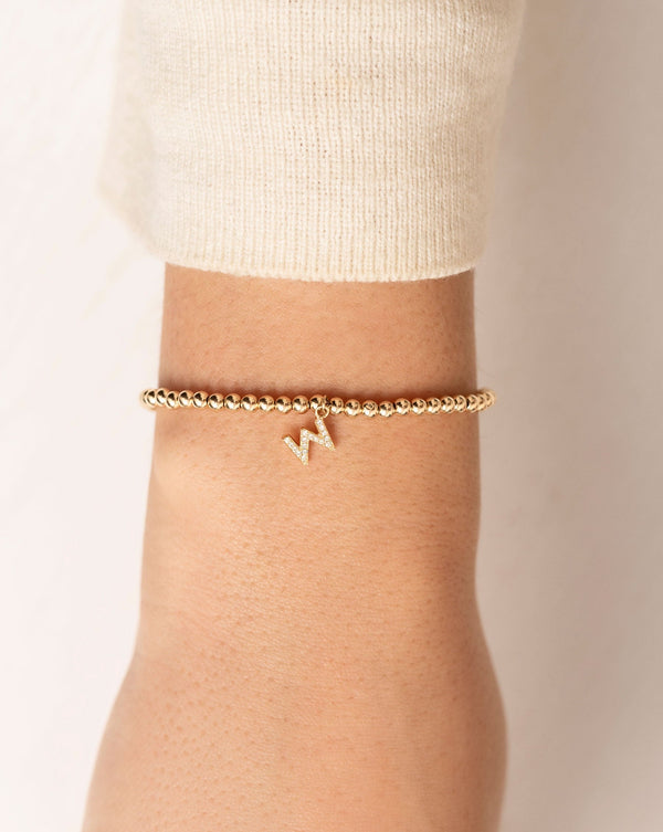 Gold Bead + Pave Initial Bracelet shown close up on wrist