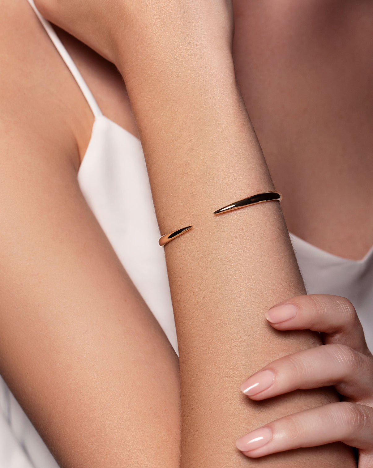 14k yellow gold claw cuff shown on model