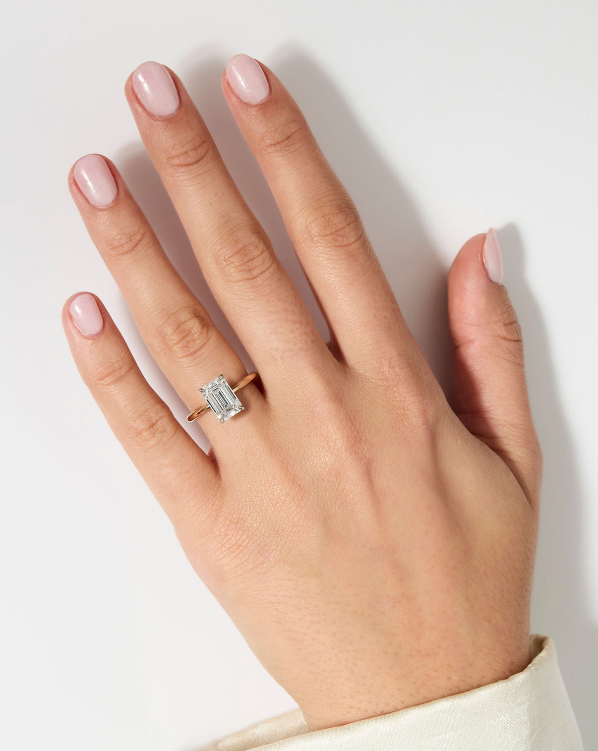 model wearing 3 carat Emerald Diamond Cloud Solitaire Engagement Ring | 14k yellow gold w/ platinum prongs