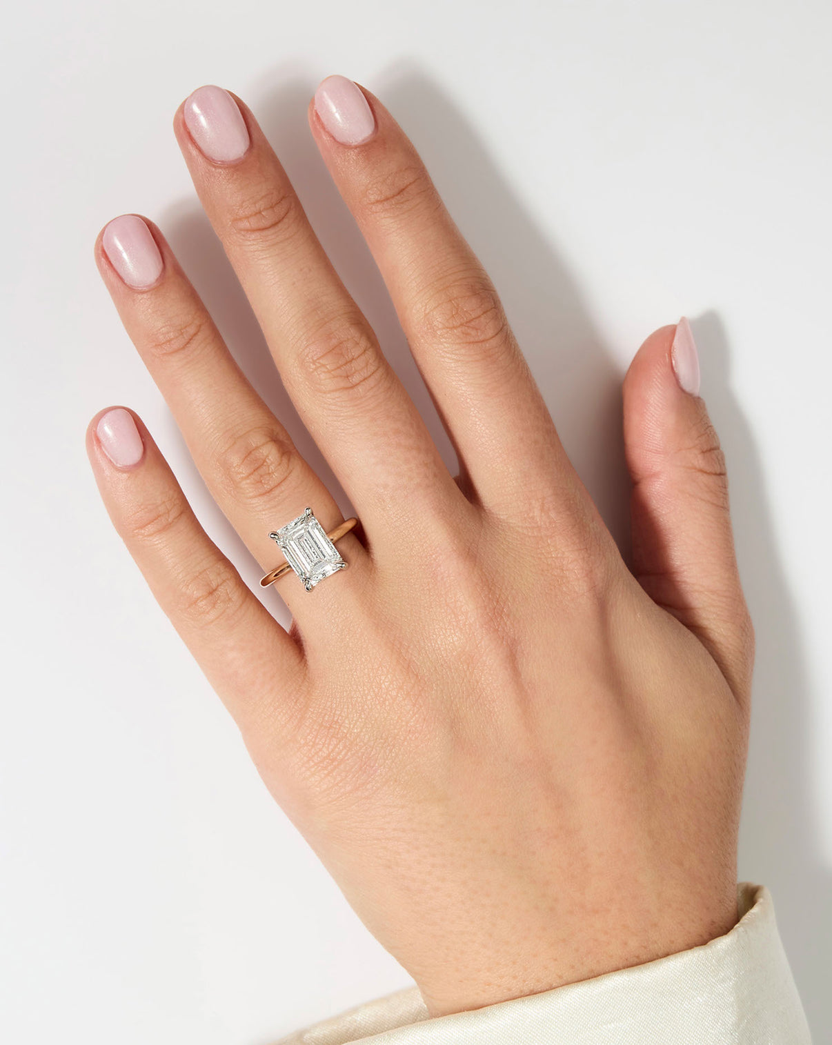 model wearing 5 carat Emerald Diamond Cloud Solitaire Engagement Ring | 14k yellow gold w/ platinum prongs