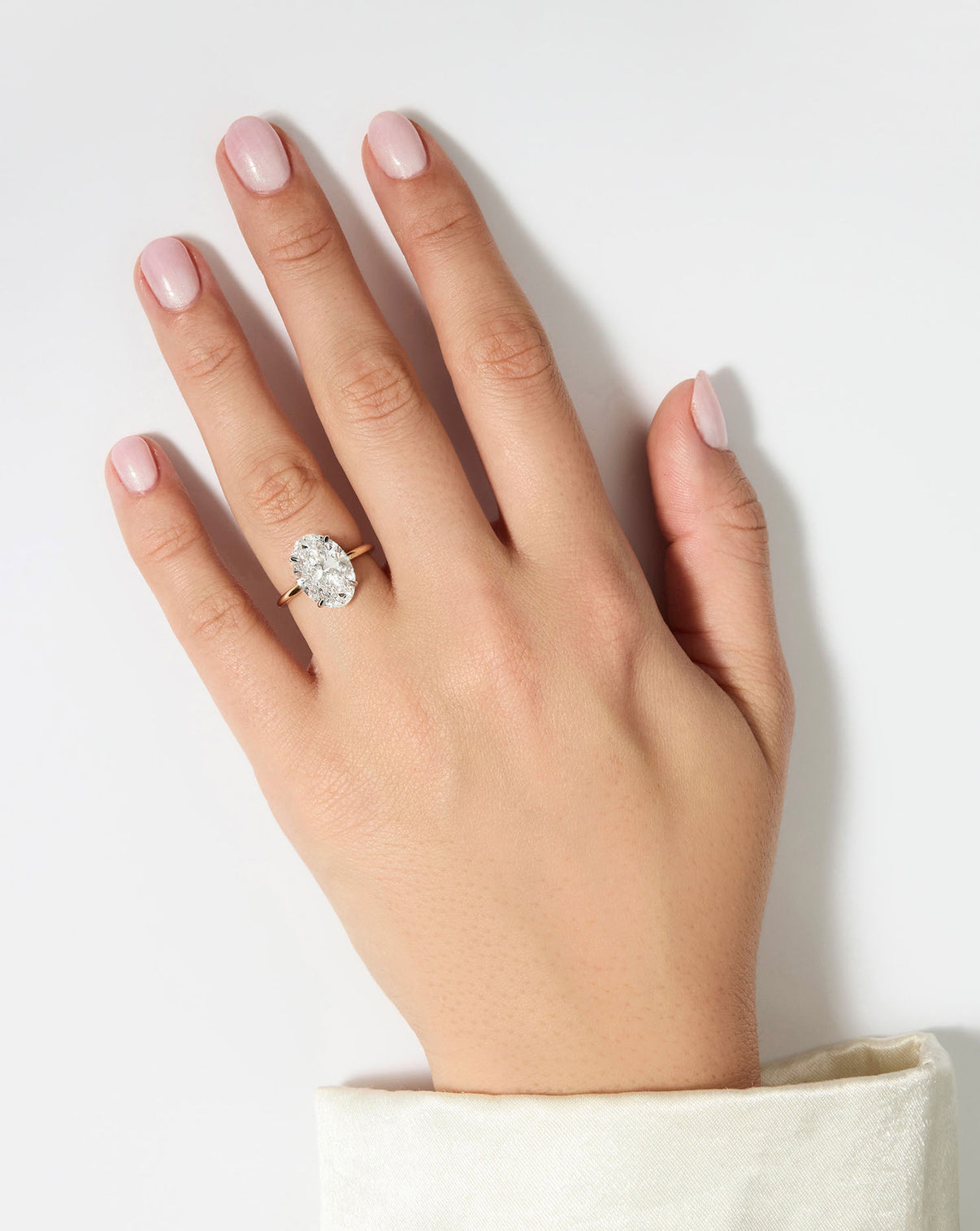 model wearing 4 carat Oval Diamond Cloud Solitaire Engagement Ring | 14k yellow gold w/ platinum prongs