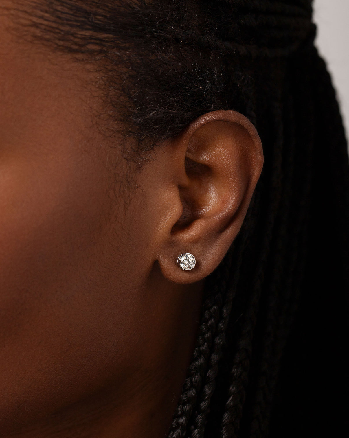 Close up image of the Bezel-Set Classic Diamond Studs in 14k white gold