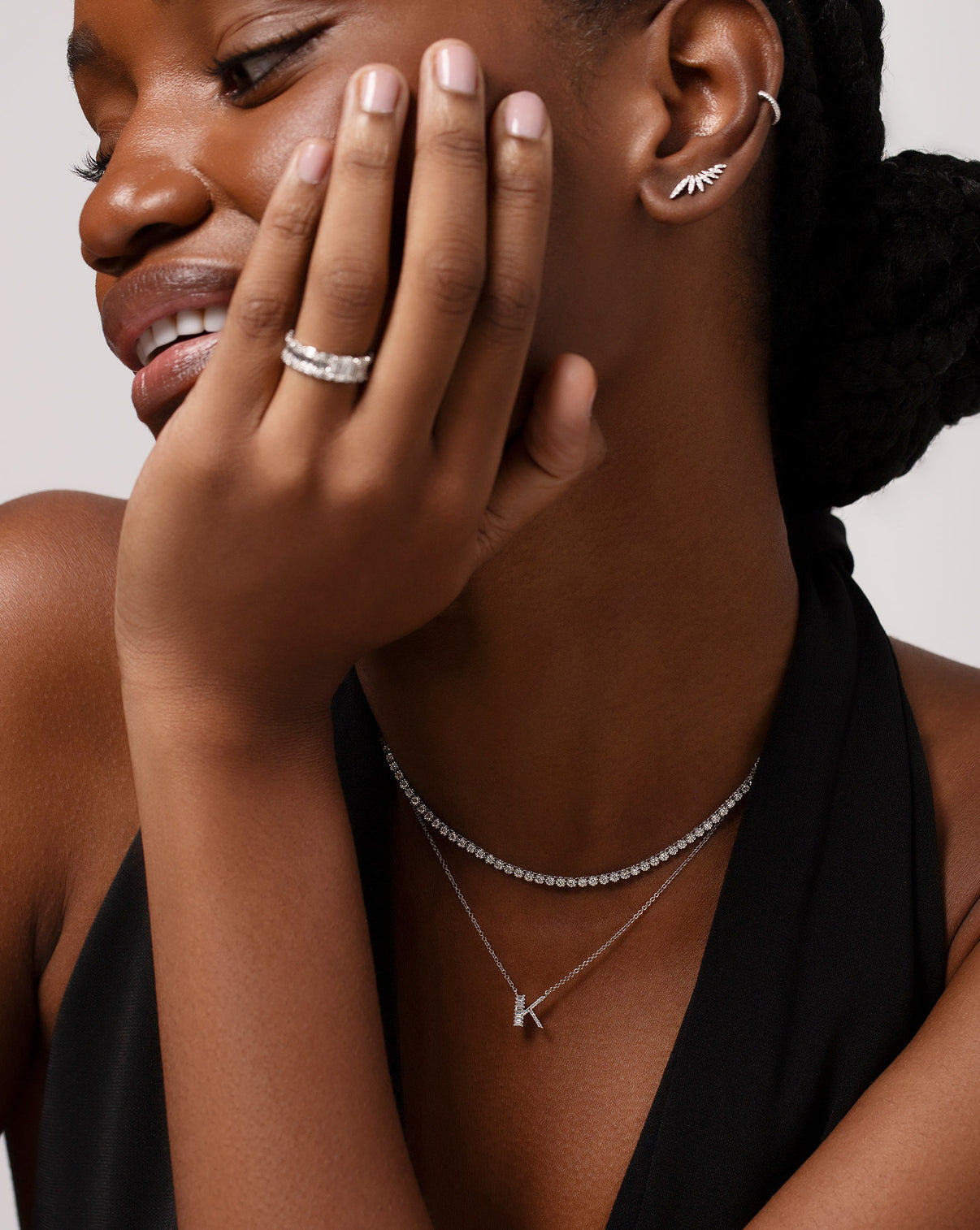 Baguette + Pavé Initial Necklace letter A styled with the Multiway Diamond Tennis Necklace + Double Wrap Bracelet on neck of model